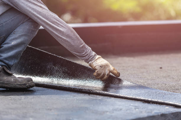 Professional Basement Waterproofing technician working in Bedford, KY